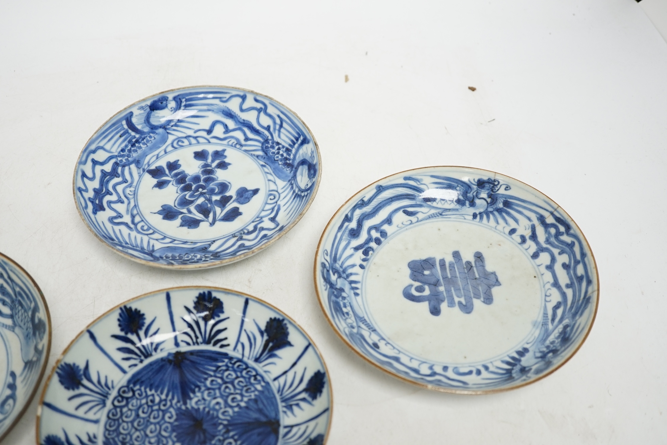 Five variously patterned Chinese blue and white saucer dishes, Kangxi period, largest 16cm diameter. Condition - chips and cracks to three items